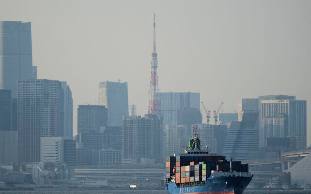 Tokyo Tower is seen amid tall buildings as a container ship leaves a cargo terminal in Tokyo, April 9, 2025. (AP Photo/Hiro Komae, File) Tokyo Tower is seen amid tall buildings as a container ship leaves a cargo terminal in Tokyo, April 9, 2025. (AP Photo/Hiro Komae, File)