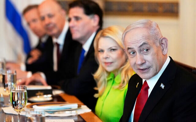 Prime Minister Benjamin Netanyahu, right, attends a meeting with US President Donald Trump (not pictured) in the Blue Room of the White House, Monday, July 7, 2025, in Washington. (AP Photo/Alex Brandon)