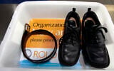 Illustrative: A belt and shoes sit in trays being used in safety screening of travelers by the US Transportation Security Administration, at the Los Angeles International Airport in Los Angeles, California, January 10, 2007. (AP Photo/Ann Johansson, File)