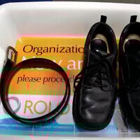 Illustrative: A belt and shoes sit in trays being used in safety screening of travelers by the US Transportation Security Administration, at the Los Angeles International Airport in Los Angeles, California, January 10, 2007. (AP Photo/Ann Johansson, File)