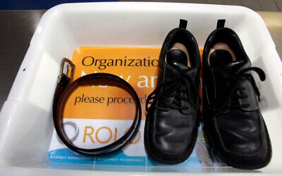 Illustrative: A belt and shoes sit in trays being used in safety screening of travelers by the US Transportation Security Administration, at the Los Angeles International Airport in Los Angeles, California, January 10, 2007. (AP Photo/Ann Johansson, File)