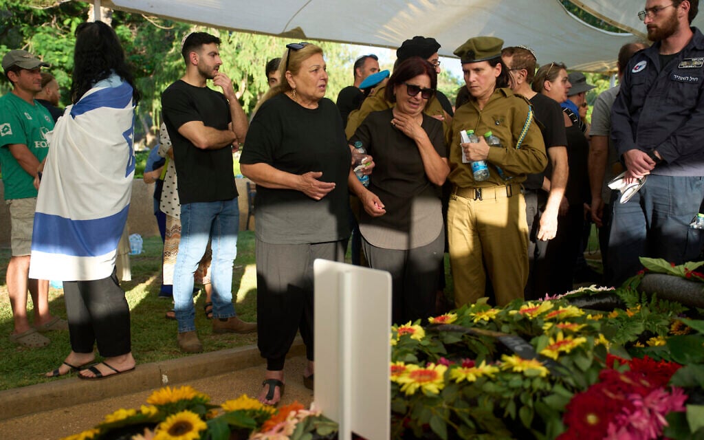 Aida, mother of Sgt. First Class (res.) Benyamin Asulin, mourns during his funeral at the military cemetery in Haifa on Tuesday, July 8, 2025. (AP Photo/Ariel Schalit)