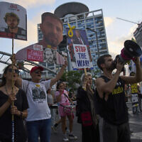 Relatives of hostages held by Hamas in the Gaza Strip and their supporters call for an immediate hostage release deal during a protest in Tel Aviv, Israel, July 10, 2025. (AP Photo/Ariel Schalit)