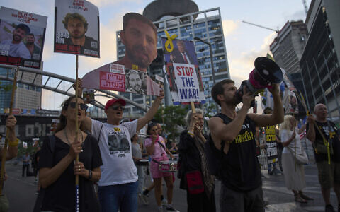 Relatives of hostages held by Hamas in the Gaza Strip and their supporters call for an immediate hostage release deal during a protest in Tel Aviv, Israel, July 10, 2025. (AP Photo/Ariel Schalit)