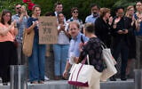 US State Department employees applaud as their colleagues walk outside of the State Department headquarters in the Harry S Truman Building, July 11, 2025, in Washington. (AP Photo/Manuel Balce Ceneta)