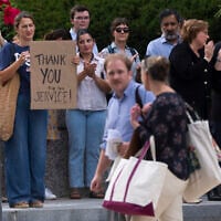 US State Department employees applaud as their colleagues walk outside of the State Department headquarters in the Harry S Truman Building, July 11, 2025, in Washington. (AP Photo/Manuel Balce Ceneta)