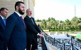 Azerbaijani President Ilham Aliyev, right, and Syria's interim president, Ahmad al-Sharaa, second left, stand on the balcony during their meeting in Baku, Azerbaijan, July 12, 2025. (Azerbaijani Presidential Press Office via AP)