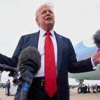 US President Donald Trump speaks to the media on arrival at Joint Base Andrews, Maryland, en route to Washington, after attending the Club World Cup final soccer match in New Jersey, July 13, 2025. (AP Photo/Jacquelyn Martin)
