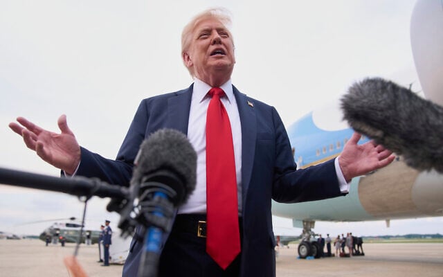 US President Donald Trump speaks to the media on arrival at Joint Base Andrews, Maryland, en route to Washington, after attending the Club World Cup final soccer match in New Jersey, July 13, 2025. (AP Photo/Jacquelyn Martin)
