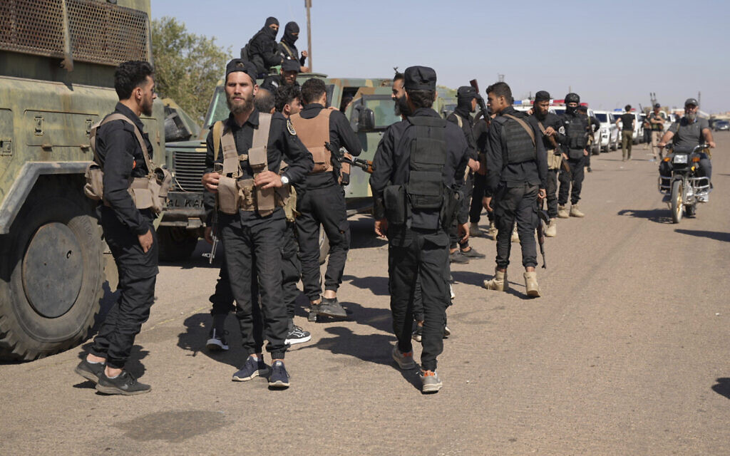 Syrian government security forces gather on the outskirts of Sweida province where clashes erupted between Druze militias and Sunni Bedouin clans, southern Syria, July 14, 2025. (AP Photo/Malek Khattab)