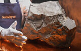 A Martian meteorite, weighing 54.388 lbs. (24.67 kg), said to be the largest piece of Mars on Earth, at Sotheby's, in New York, July 9, 2025. (AP Photo/Richard Drew)