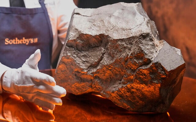 A Martian meteorite, weighing 54.388 lbs. (24.67 kg), said to be the largest piece of Mars on Earth, at Sotheby's, in New York, July 9, 2025. (AP Photo/Richard Drew)