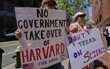 Protestors gather outside the Moakley Federal Courthouse, where Harvard University appeared to challenge $2.6 billion in funding cuts by the Trump administration, July 21, 2025, in Boston. (AP Photo/Charles Krupa)