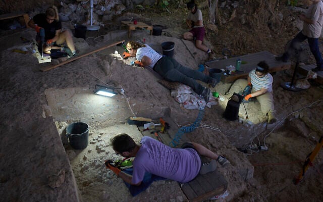 Volunteers work in Tinshemet Cave, where archaeologists are excavating one of the world's oldest known burial sites, dating back 100,000 years, near the central town of Shoam, July 15, 2025. (AP Photo/Ariel Schalit)