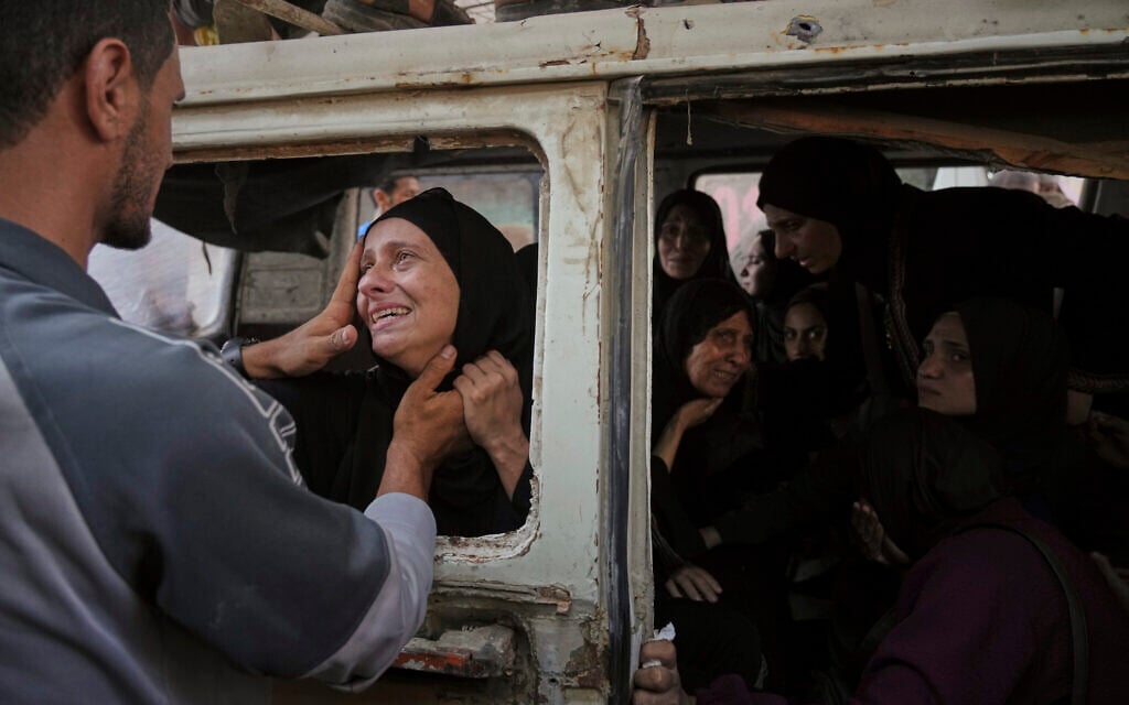 Palestinians mourn their relatives killed from an Israeli strike in Gaza, at Shifa Hospital in Gaza City, July 22, 2025. (AP Photo/Jehad Alshrafi)