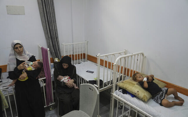 Palestinian women care for their malnourished babies at the Friends of the Patient Hospital in Gaza City on July 23, 2025. (AP/Jehad Alshrafi) Palestinian women care for their malnourished babies at the Friends of the Patient Hospital in Gaza City on July 23, 2025. (AP/Jehad Alshrafi)