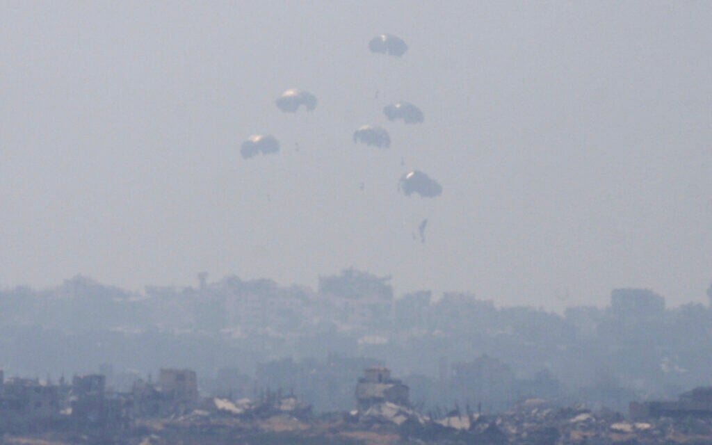 Humanitarian aid is airdropped to Palestinians over Gaza City, as seen from southern Israel, July 27, 2025. (AP/Ohad Zwigenberg)