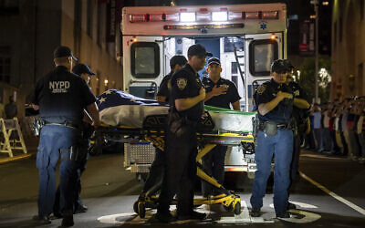 NYPD officers bring out the body of Didarul Islam, who was shot and killed by a gunman earlier this evening, from New York-Presbyterian/Weill Cornell Medical Hospital, early Tuesday, July 29, 2025, in New York City. (AP Photo/Angelina Katsanis)