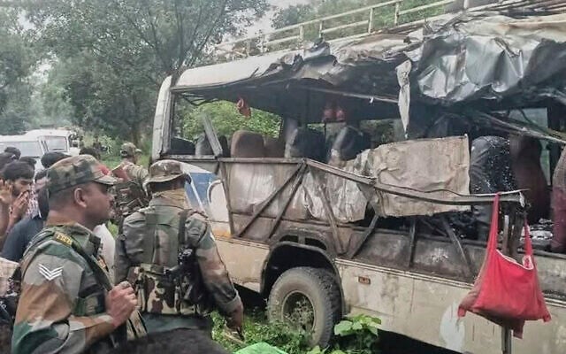 Indian paramilitary force soldiers inspect the wreckage of a bus that was carrying Hindu pilgrims which collided with a transport truck at Deoghar, about 268 kilometers (167 miles) from Ranchi, in the Indian eastern state of Jharkhand, July, 29, 2025. (AP Photo)