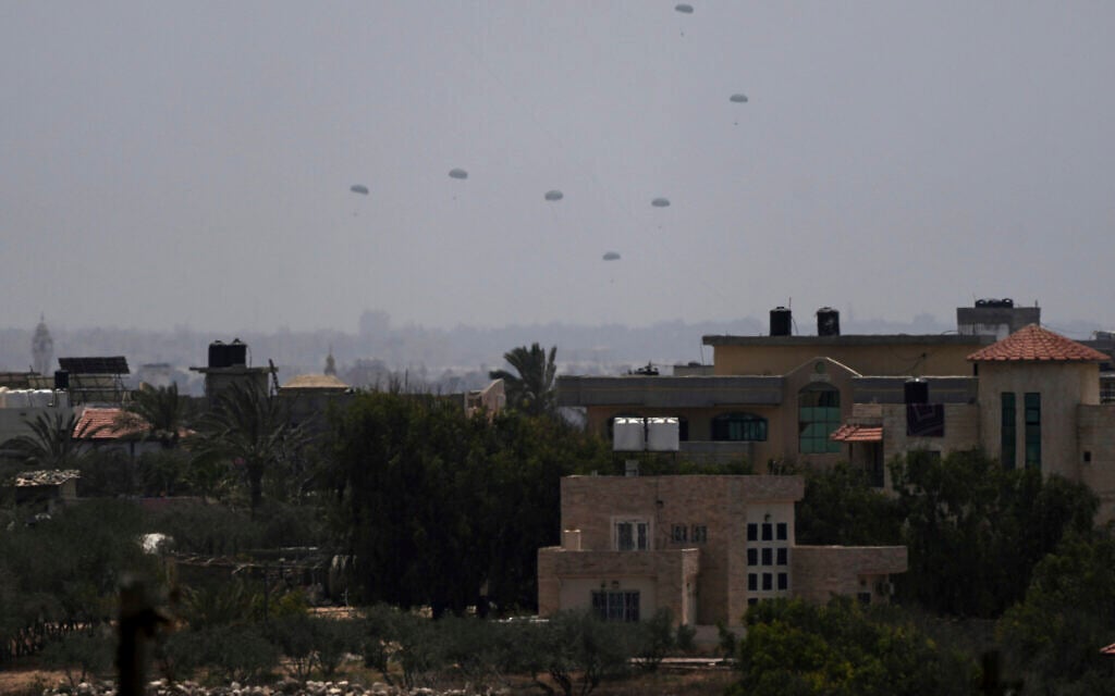 Humanitarian aid is airdropped to Palestinians over the central Gaza Strip Tuesday, July 29, 2025. (AP/Abdel Kareem Hana)