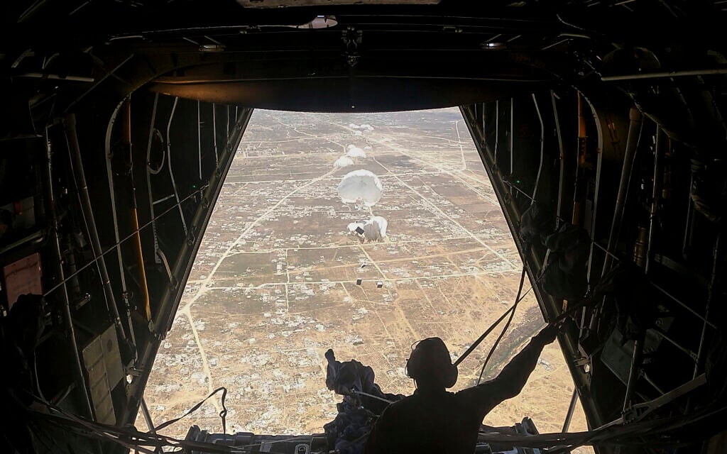 Humanitarian aid destined for Palestinians is airdropped over the Gaza Strip by a Jordanian Air Force aircraft on Tuesday, July 29, 2025. (AP Photo/Malak Harb)
