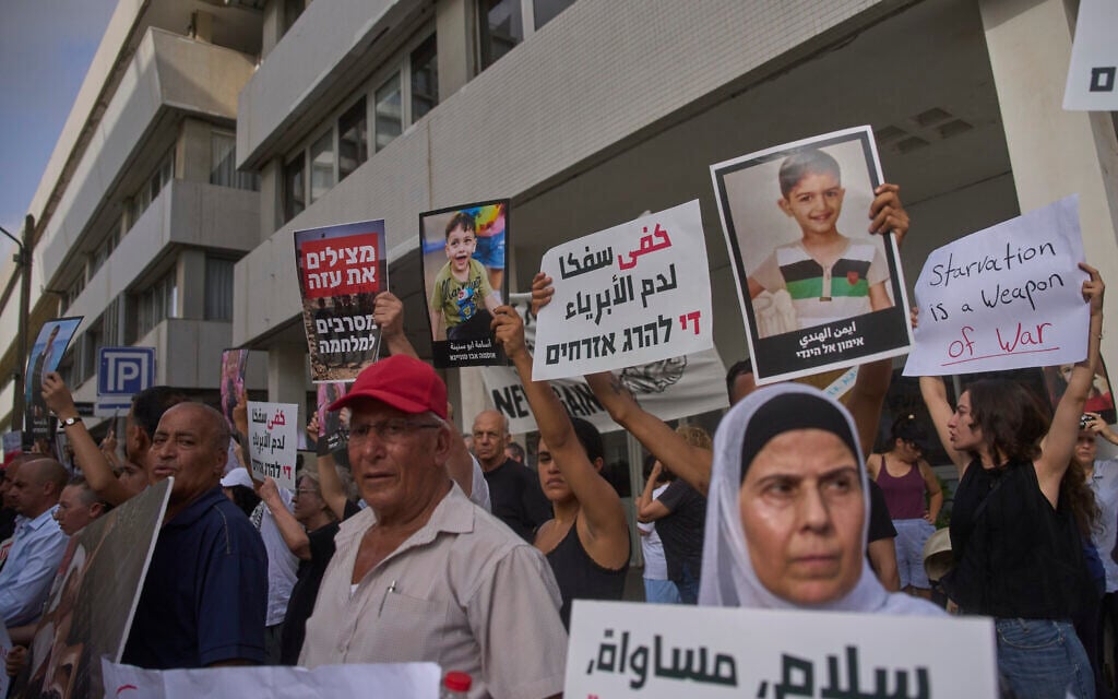 Israeli activists take part in a protest against the war in the Gaza Strip outside of the US embassy branch office in Tel Aviv, Israel, Tuesday, July 29, 2025. (AP/Ohad Zwigenberg)