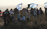 Right-wing activists attend a rally calling for the reestablishment of Jewish settlements in the Gaza Strip, near the border in southern Israel, July 30, 2025. (AP Photo/Ohad Zwigenberg)