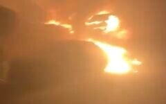 A screenshot of video showing cars that were allegedly set ablaze by Israeli settlers, on the outskirts of the West Bank Palestinian village of Burqa, July 14, 2025. (X Screenshot)