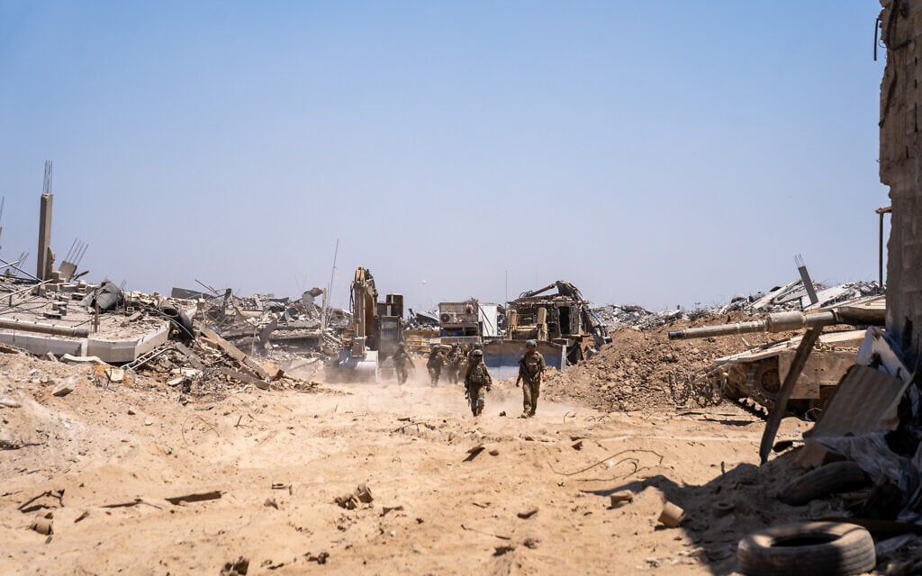 IDF troops are seen on the outskirts of Gaza City's Daraj and Tuffah neighborhoods, July 23, 2025. (Emanuel Fabian/Times of Israel)
