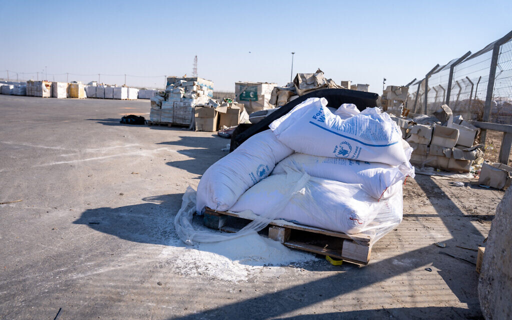 A ripped sack of flour from the World Food Programme is seen Gazan side of the Kerem Shalom Crossing, in the southern Gaza Strip, July 24, 2025. (Emanuel Fabian/Times of Israel)