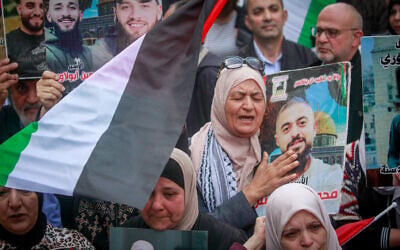 Illustrative: Palestinian protesters hold pictures of Palestinian prisoners in Israeli jails during a rally in the center of the West Bank city of Nablus to mark Palestinian Prisoners' Day on April 16, 2025. (Nasser Ishtayeh/Flash90) Illustrative: Palestinian protesters hold pictures of Palestinian prisoners in Israeli jails during a rally in the center of the West Bank city of Nablus to mark Palestinian Prisoners' Day on April 16, 2025. (Nasser Ishtayeh/Flash90)
