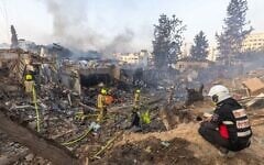 Israeli security and rescue forces at the scene where a ballistic missile fired from Iran hit and caused damage in Rehovot, June 15, 2025. (Yossi Aloni/Flash90)