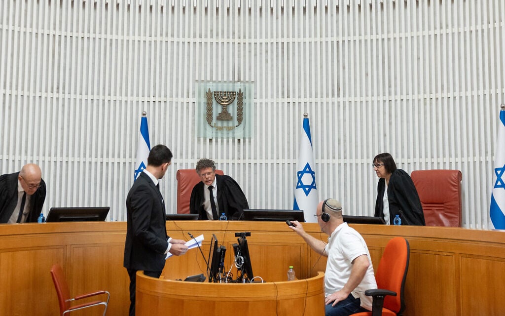 Supreme Court President Isaac Amit (center), Justice Alex Stein (left) and Justice Gila Canfy Steinitz at a Supreme Court hearing on petitions over whether Prime Minister Benjamin Netanyahu can appoint the head of the Shin Bet, July 1, 2025. (Yonatan Sindel/FLASH90)