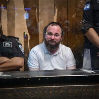 Chaim Rotter, arrested on suspicion of numerous sex offenses, at a court hearing at the Magistrate's Court in Tel Aviv on July 2, 2025 (Avshalom Sassoni/Flash90)