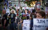 Demonstrators protest for the release of Israelis held hostage in the Gaza Strip, outside the Defense Ministry headquarters in Tel Aviv, July 2, 2025. (Erik Marmor/Flash90)