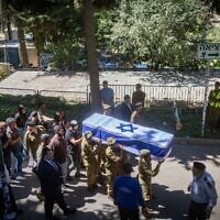 Family and friends of Staff Sgt. Noam Aharon Musgadian attend his funeral at the Mount Herzl military cemetery in Jerusalem on July 8, 2025. (Chaim Goldberg/Flash90)