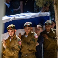 Family and friends of slain soldier Staff Sgt. Moshe Shmuel Noll attend his funeral at the Mount Herzl Military Cemetery in Jerusalem on July 9, 2025. (Chaim Goldberg/Flash90)