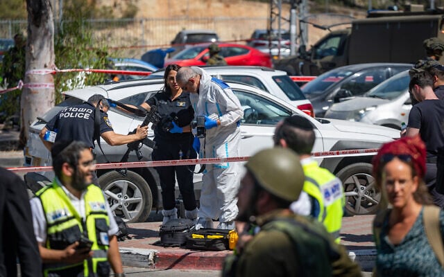 Soldiers and rescue officials at the scene of a terror attack at a shopping complex at Gush Etzion Junction, in the West Bank, on July 10, 2025. (Yonatan Sindel/Flash90)