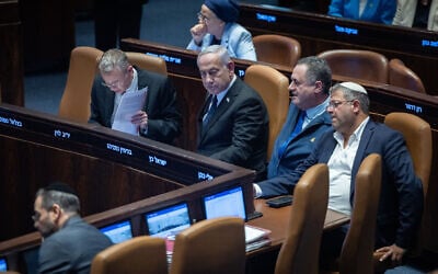 L to R: Justice Minister Yariv Levin, Prime Minister Benjamin Netanyahu, Defense Minister Israel Katz, and National Security Minister Itamar Ben Gvir are seen in the Knesset in Jerusalem, ahead of a failed vote on MK Ayman Odeh's proposed expulsion from the body. (Yonatan Sindel/Flash90)