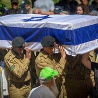 Friends and family attend the funeral of Israeli soldier Sgt. Shlomo Yakir Shrem, who was killed during an Israeli military operation in the Gaza Strip, at the military cemetery in Kfar Etzion, July 15, 2025. (Yonatan Sindel/ Flash90)
