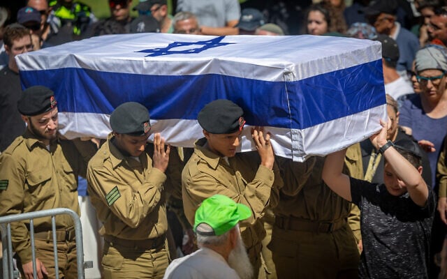 Friends and family attend the funeral of Israeli soldier Sgt. Shlomo Yakir Shrem, who was killed during an Israeli military operation in the Gaza Strip, at the military cemetery in Kfar Etzion, July 15, 2025. (Yonatan Sindel/ Flash90)