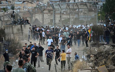 Druze in Israel protest near the Israeli-Syrian border fence in solidarity with Druze in Syria, July 16, 2025. (Michael Giladi/Flash90)