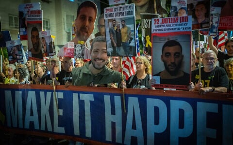 Families of hostages, former captives and their supporters march to the US embassy branch in Tel Aviv, during a rally calling for the release of all hostages, July 19, 2025. (Erik Marmor/Flash90)