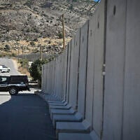 Israeli security forces stand guard at the Israeli border fence with Syria, near the Druze town of Majdal Shams in the Golan Heights, July 19, 2025. (Michael Giladi/Flash90)