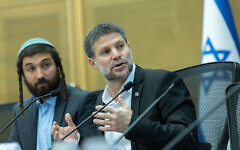 Finance Minister Bezalel Smotrich, right, attends a Knesset conference discussing Jewish settlement in the Gaza Strip at the Knesset in Jerusalem, July 22, 2025. (Chaim Goldberg/Flash90)