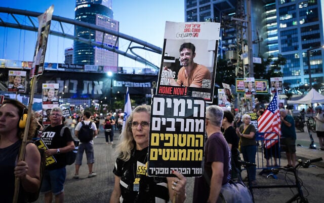 Protesters rally for the release of Israelis held hostage by Hamas in the Gaza Strip, outside the Kirya military base in Tel Aviv, July 23, 2025. (Avshalom Sassoni/Flash90)