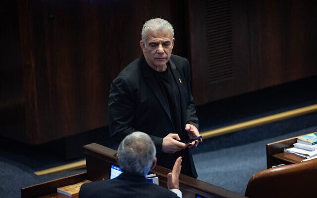 Opposition Leader Yair Lapid on the plenum floor of the Knesset in Jerusalem, July 23, 2025. (Yonatan Sindel/Flash90) Opposition Leader Yair Lapid on the plenum floor of the Knesset in Jerusalem, July 23, 2025. (Yonatan Sindel/Flash90)