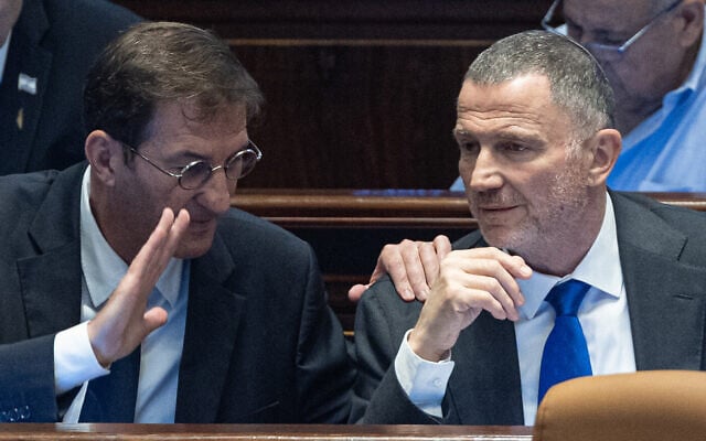 Likud MK Boaz Bismuth (left) speaks with party colleague Yuli Edelstein during a discussion on a non-binding proposal to apply sovereignty over the West Bank, in the Knesset on July 23, 2025. (Yonatan Sindel/Flash90)