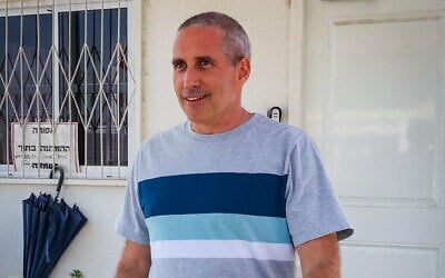 Likud MK Hanoch Milwidsky (right) is seen leaving the Lahav 433 police unit headquarters in Lod on July 25, 2025 (Roy Alima/Flash90)