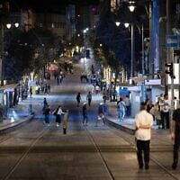 People run to take cover in Jerusalem, as an alarm is sounded warning for incoming ballistic missiles fired from Yemen into Israel, July 29, 2025. (Chaim Goldberg/Flash90)
